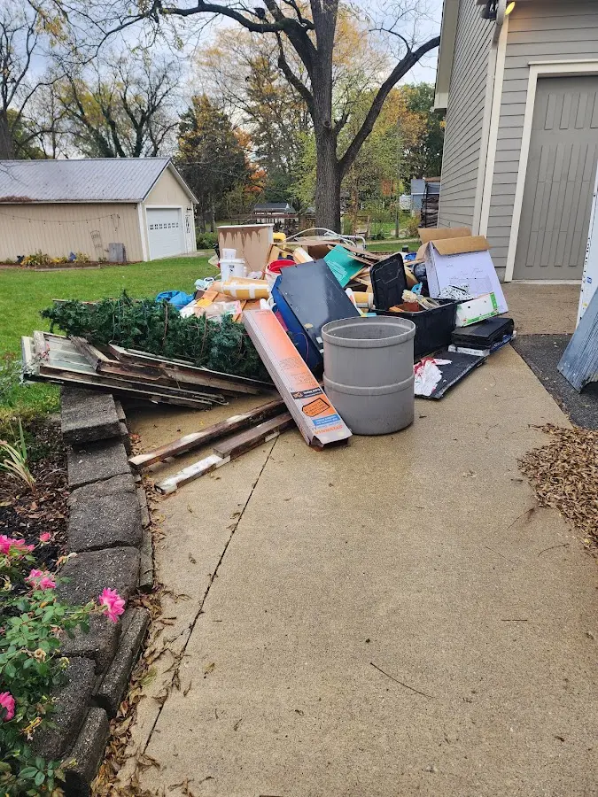 Dumpster being loaded with debris for Residential Dumpster Rental in Springdale